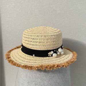 Elegant Straw Hat with Black Band and Pearl Accents